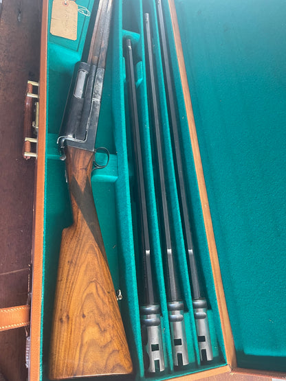Exceptional 1950s Cosmi Brevettato Special-Order 12 Gauge – Three-Barrel Set – Case-Hardened Receiver – English Straight-Hand Stock – Original Fitted Case – Robert Foman Provenance